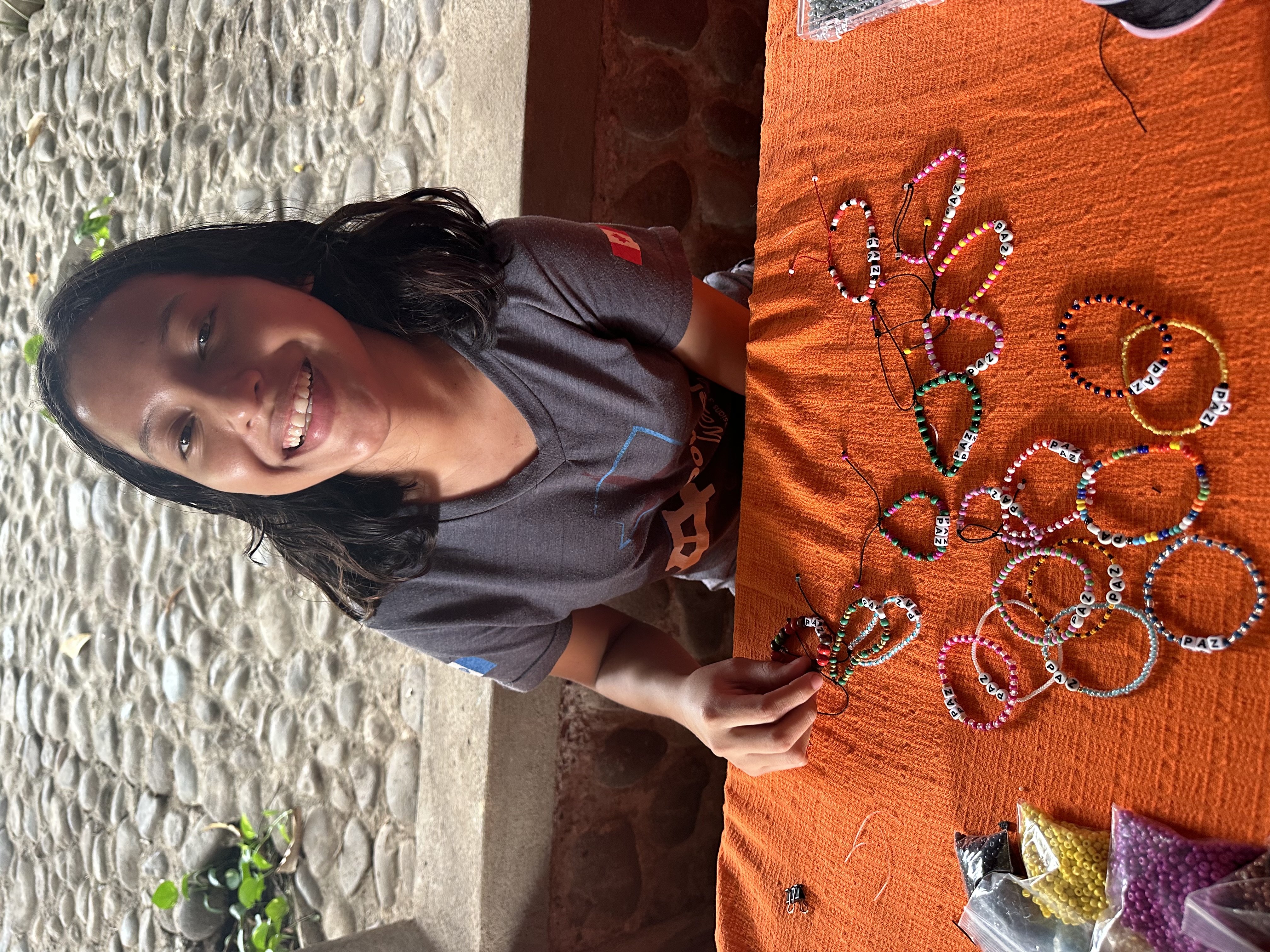 Paula working on accronym bracelets